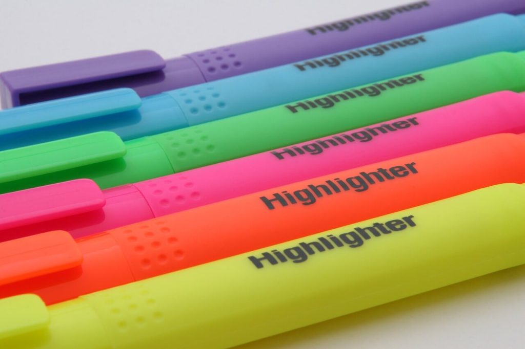 Highlighter pens with different colours on a white background